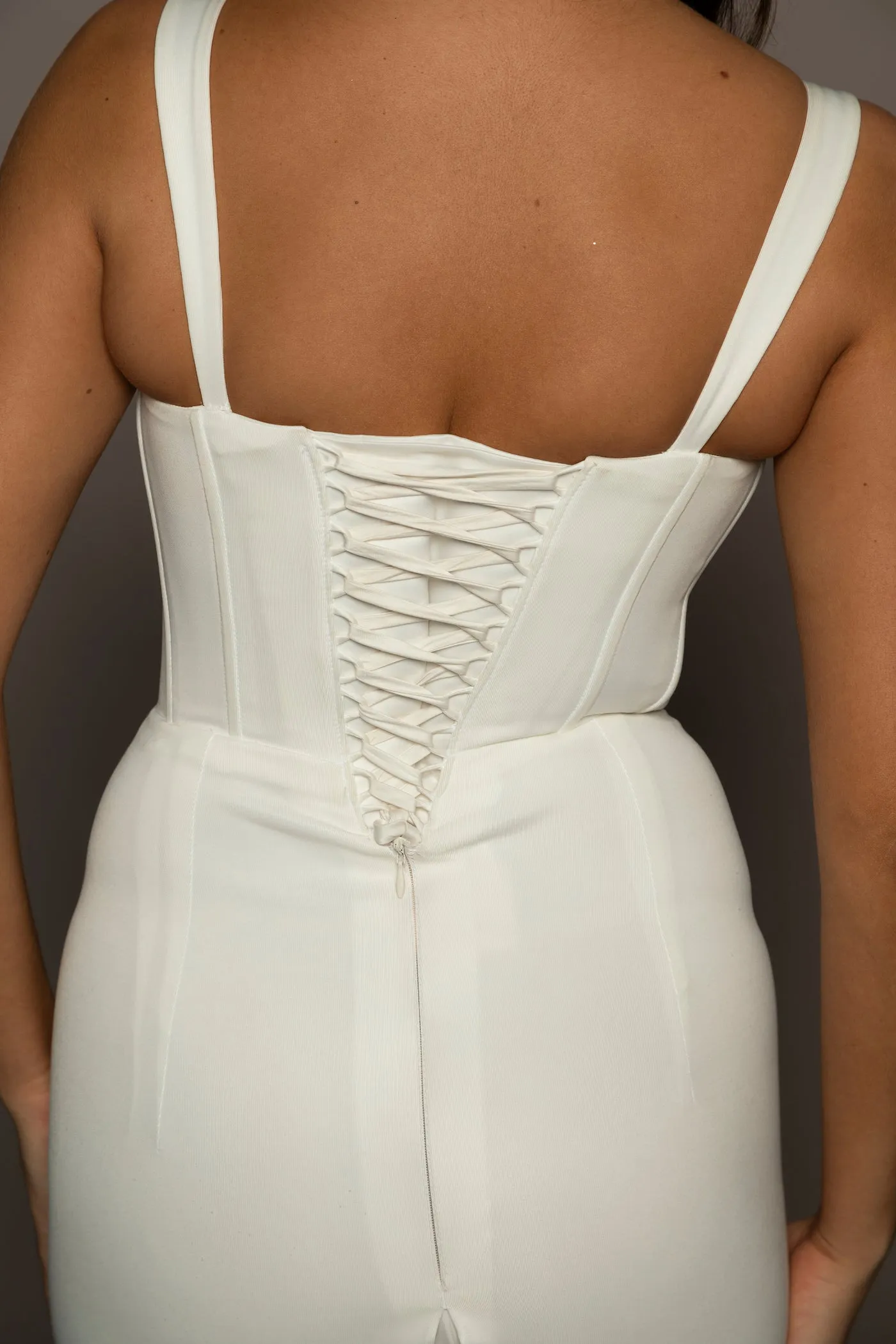 White bustier mermaid dress with lace up back