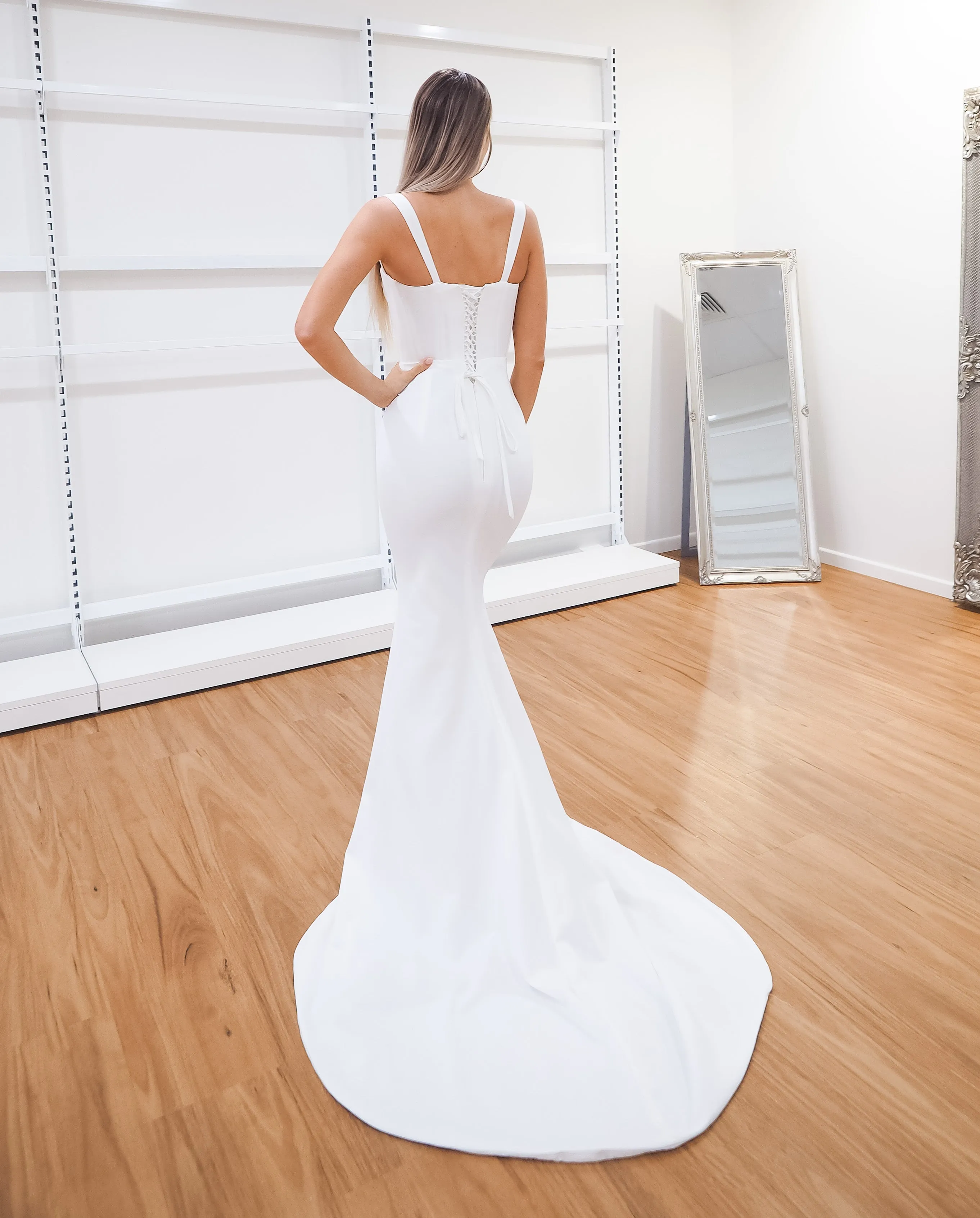 White bustier mermaid dress with lace up back